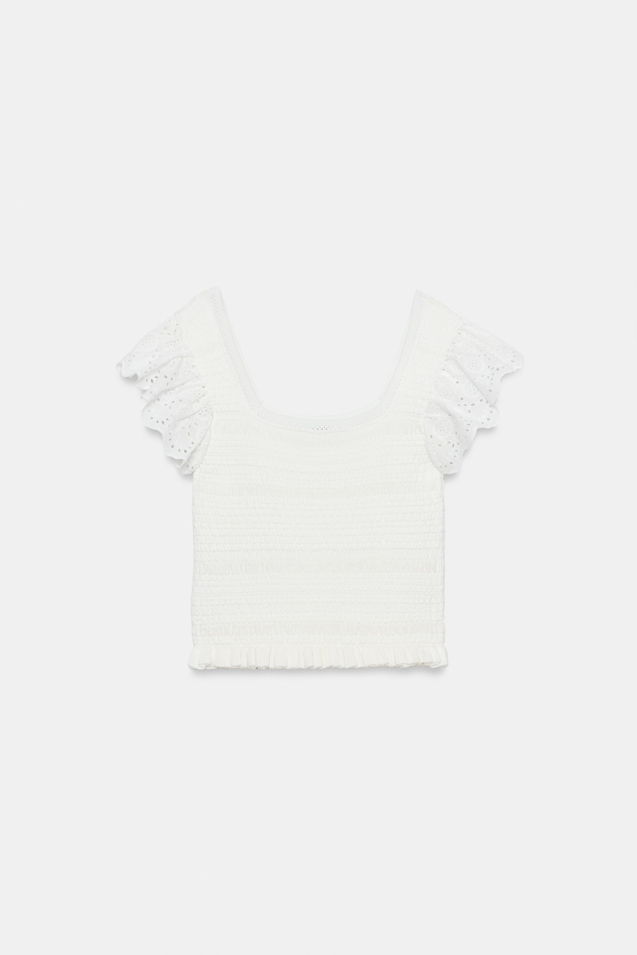 TOP EN MAILLE À BRODERIES PERFORÉES